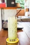 Glass Of Iced Green Tea Latte Stock Photo