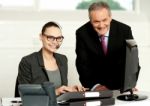 Cheerful Corporate People At Work In Office Stock Photo