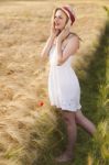 Cheerful Beautiful Young Blonde Girl In White Dress With Straw H Stock Photo