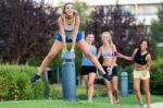 Running Girls Having Fun In The Park Stock Photo