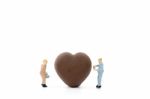 Miniature Worker Making Heart Shaped Chocolate On White Background , Stock Photo