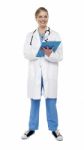 Female Doctor Writing Clipboard Stock Photo