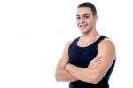 Young Fit Smiling Guy Posing Confidently Stock Photo