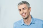 Smiling Young Man Posing To The Camera Stock Photo