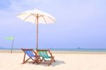 Beach Chairs And White Umbrella Stock Photo