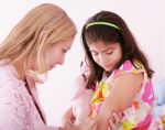 Girl Being Injected Stock Photo