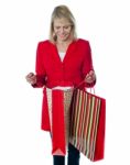 Senior Lady Holding Shopping Bag Stock Photo