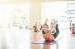 Asian Woman Doing Yoga Indoors Stock Photo