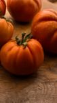 Freshly Picked Tomatoes, Place On Wooden Chopping Board And Table Stock Photo