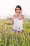 Model Sitting In Field Stock Photo