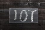 Blackboard Written With The Letters Iot, The Internet Of Things Stock Photo