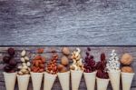 Concept For Homemade Various Nuts Ice Cream. Mixed Nuts In Waffl Stock Photo