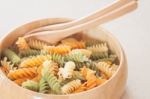 Raw Fusilli Pasta In Wooden Bowl Stock Photo