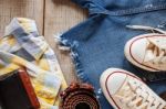 Clothing On Wooden Floor Stock Photo