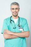 Smiling Physician, Arms Crossed Stock Photo