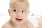 Smiling Baby Lying Stock Photo