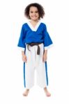 Smiling Young Girl In Karate Uniform Stock Photo