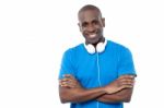 Smiling Young Guy Hanging Headphones In His Neck Stock Photo