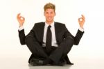 Businessman Doing Yoga Stock Photo