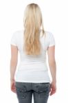 Back Pose Of A Young Woman In Casuals Stock Photo