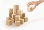 Single Hand Playing Wooden Box On Isolated Background Stock Photo