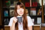 Portrait Of Thai Adult Student University Uniform Beautiful Drinking Coffee Stock Photo