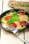 Spaghetti Pasta With Baked Cherry Tomatoes And Basil Stock Photo