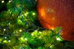 Close Up Big Red Glitter Ball Christmas On Tree With Wire White Light Background Stock Photo