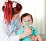 Baby And Medical Instrument Stock Photo