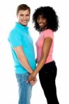 Happy Young Couple Holding Hands Stock Photo