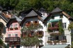 Colourful Red Geraniums On Houses In Hallstatt Stock Photo