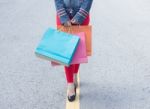 High Heels Girls With Shopping Bags Walking On Street Stock Photo