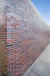 Perspective Of Tall Brick Wall Stock Photo