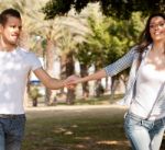 Young Couple Holding Hands Stock Photo