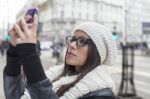 Young Woman Looking At Mobile Phone Stock Photo