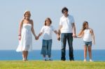 Happy family holding hands Stock Photo