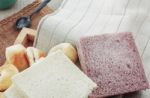 Breads And Cups On Tablecloth Stock Photo