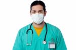 Young Male Surgeon Wearing A Face Mask Stock Photo