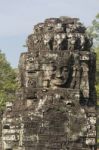 Ancient Stone Faces Of King Jayavarman Vii At The Bayon Temple, Stock Photo