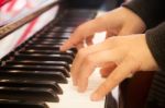 Woman Playing On Piano Keyboard Stock Photo