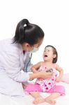 Portrait Of Confident Female Doctor Looking At Patient During Medical Treatment Stock Photo