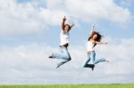 Jumping For Joy Outdoors Stock Photo