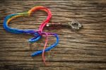 Colorful  Yarn Heart Shape And Key On Wood Textured Background U Stock Photo