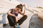 Woman Relaxing After Sports And Drinking Water Stock Photo