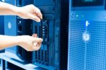 Man Fix Server Network In Data Center Room Stock Photo