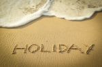 Holiday Text Written On The Beach Stock Photo