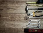 Set Of Tools Over A Wood Background Stock Photo