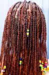 Hair Braiding With Colorful Beads Stock Photo