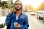 Modern Young Man With Mobile Phone In The Street Stock Photo