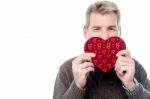 Mature Man Holding Heart Shaped Gift Box Stock Photo